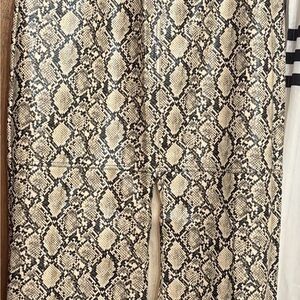 Snake Print Leather Maxi skirt in Beige and Black also has pockets .